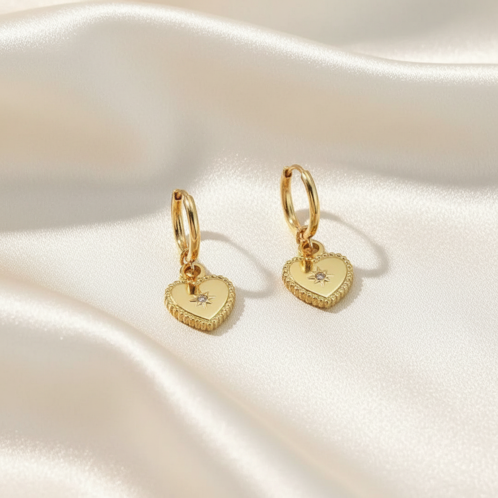 Trove Colombo Amethyst gold heart drop earrings with a small central star-set diamond.