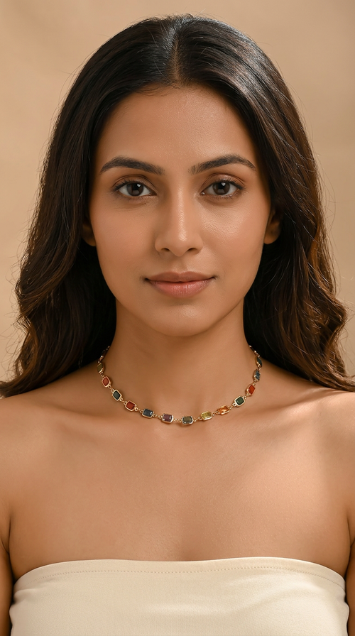Trove Colombo Acacia necklace featuring multi-colored synthetic gemstones on a polished gold-tone stainless steel chain