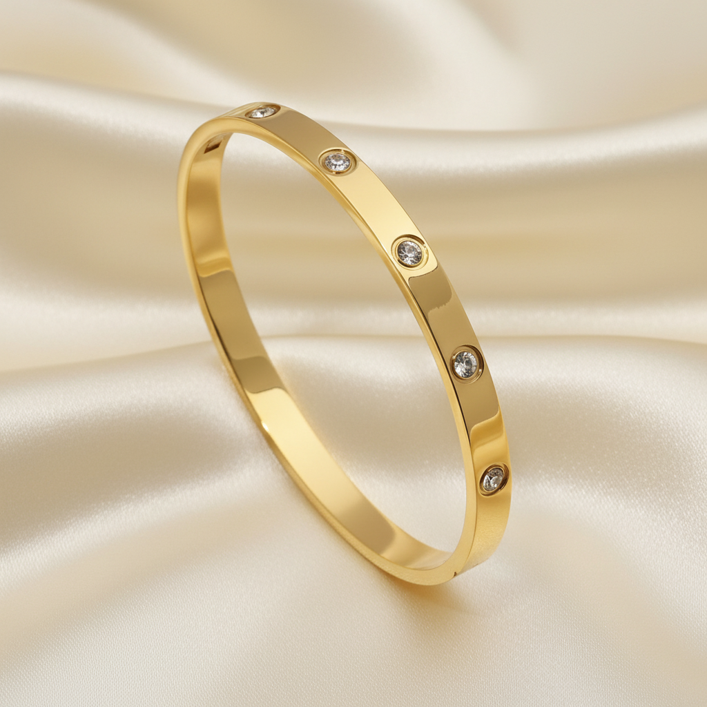 Trove Colombo Atlas 18K gold-plated titanium steel bangle featuring a star-studded design with cubic zirconia stones.