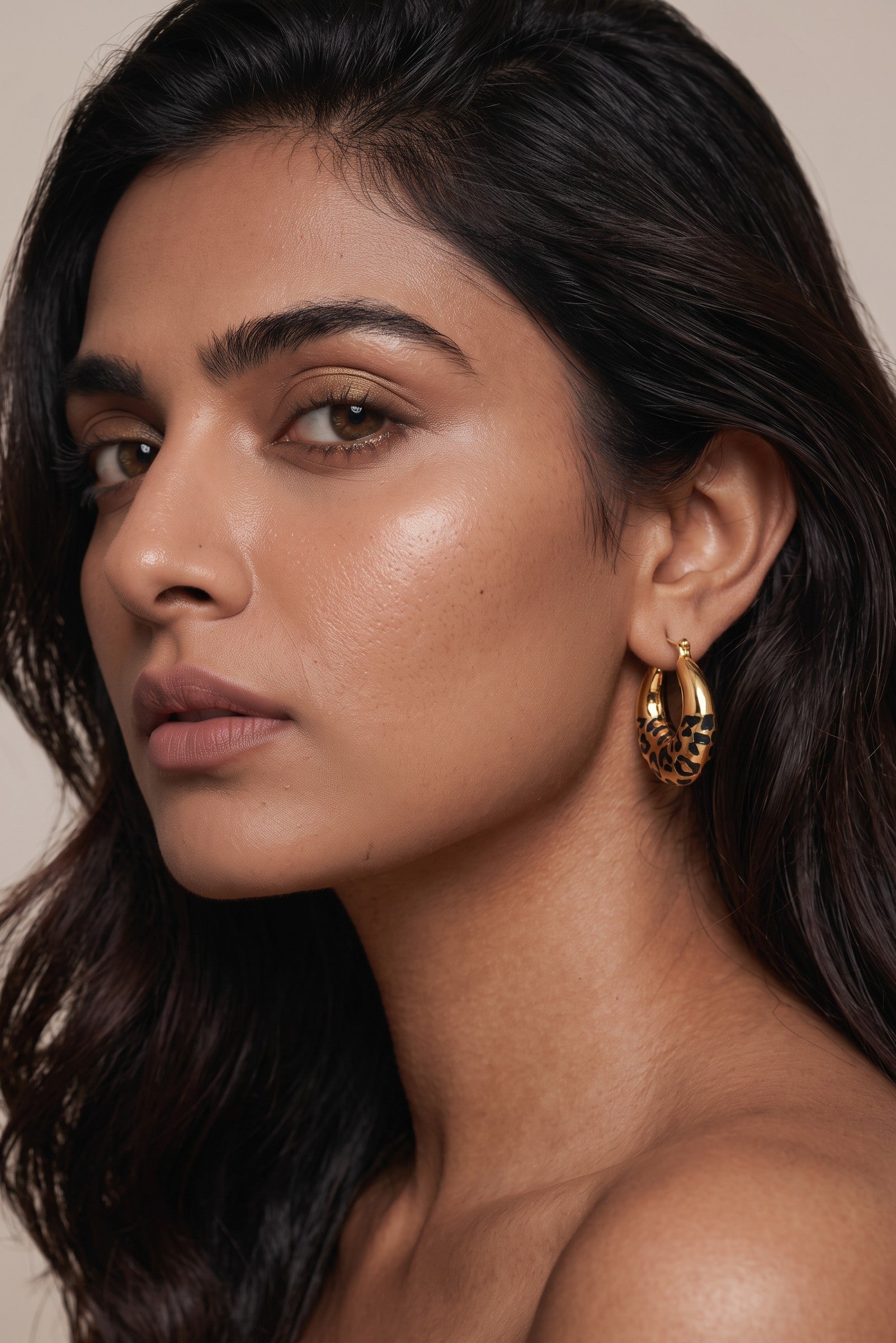 Trove Colombo Elara hoop earrings featuring a vintage-inspired gold and black leopard print design