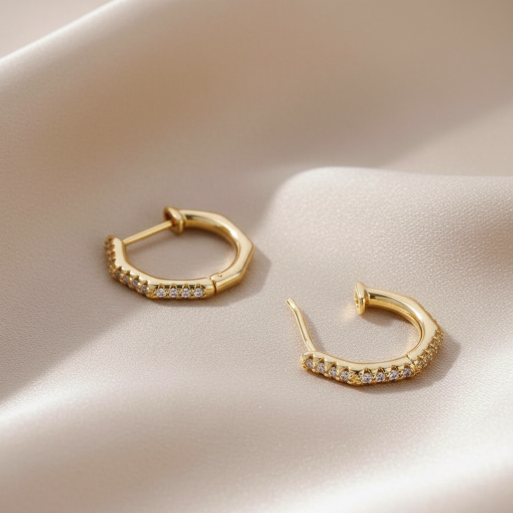 Trove Colombo Alina Zirconia gold hoop earrings with delicate crystal embellishments.