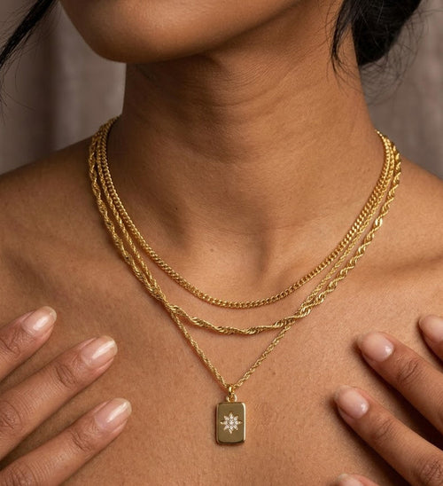 Trove Colombo Amelia 3pc gold stainless steel layered necklace with a rectangular starburst pendant and cubic zirconia