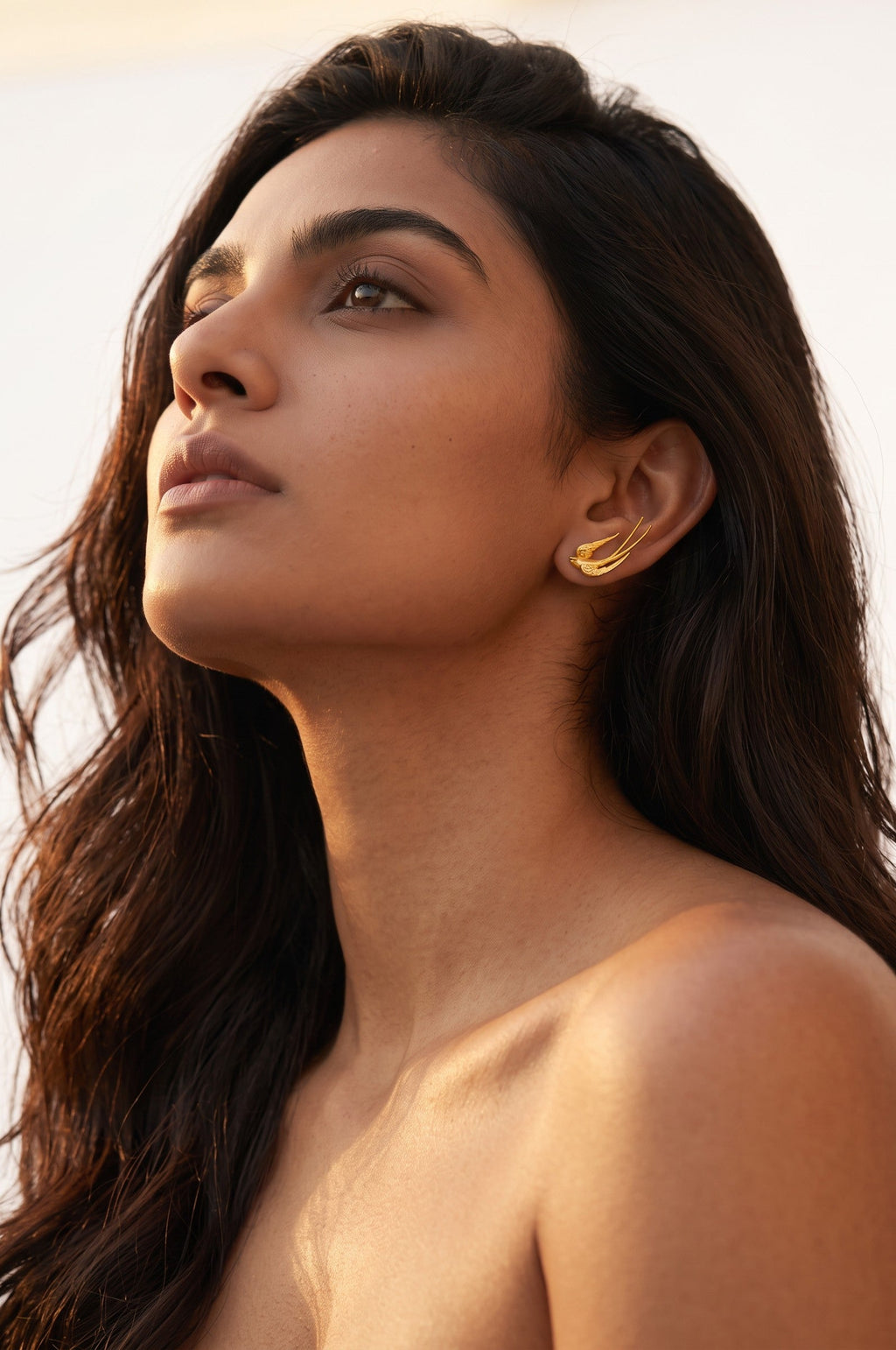 Trove Colombo Cassienne 18K gold plated earrings featuring a delicate bird design