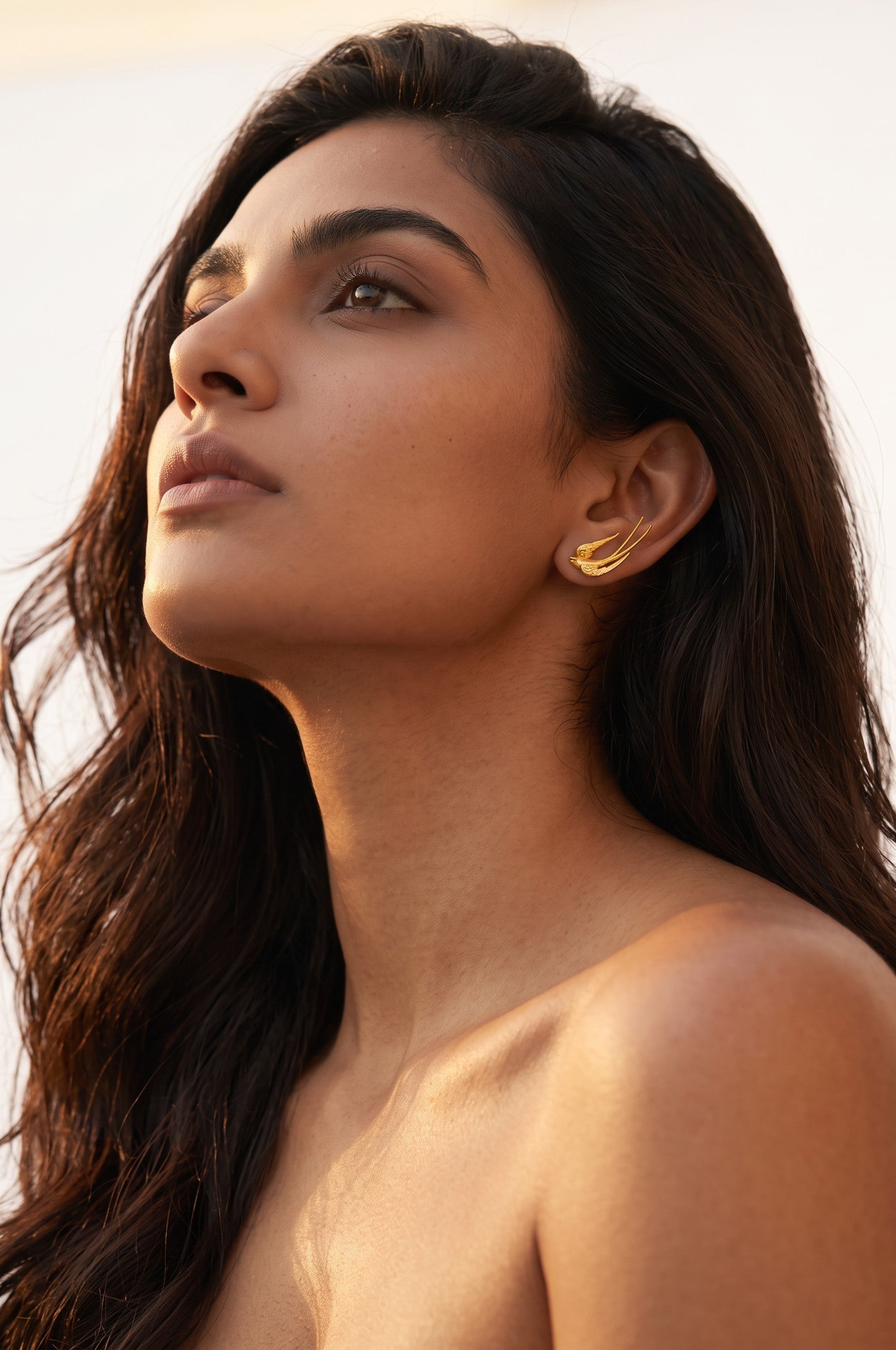 Trove Colombo Cassienne 18K gold plated earrings featuring a delicate bird design