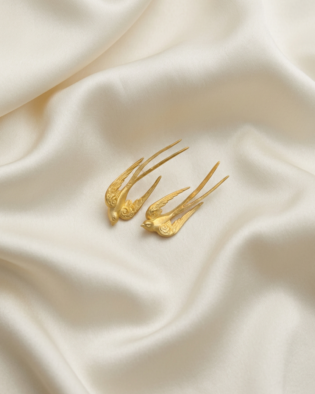 Trove Colombo Cassienne 18K gold plated zinc alloy earrings featuring an elegant bird design