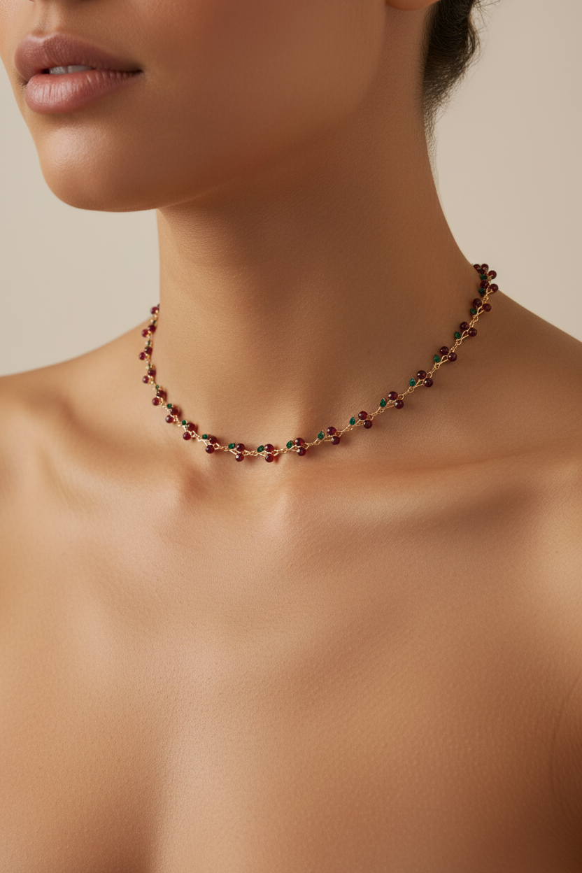 Trove Colombo Cheryl necklace featuring a delicate gold chain with small red and green cherry-inspired beads