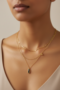Trove Colombo Cordelia layered necklace in 18K gold plated stainless steel with a black ceramic oval pendant