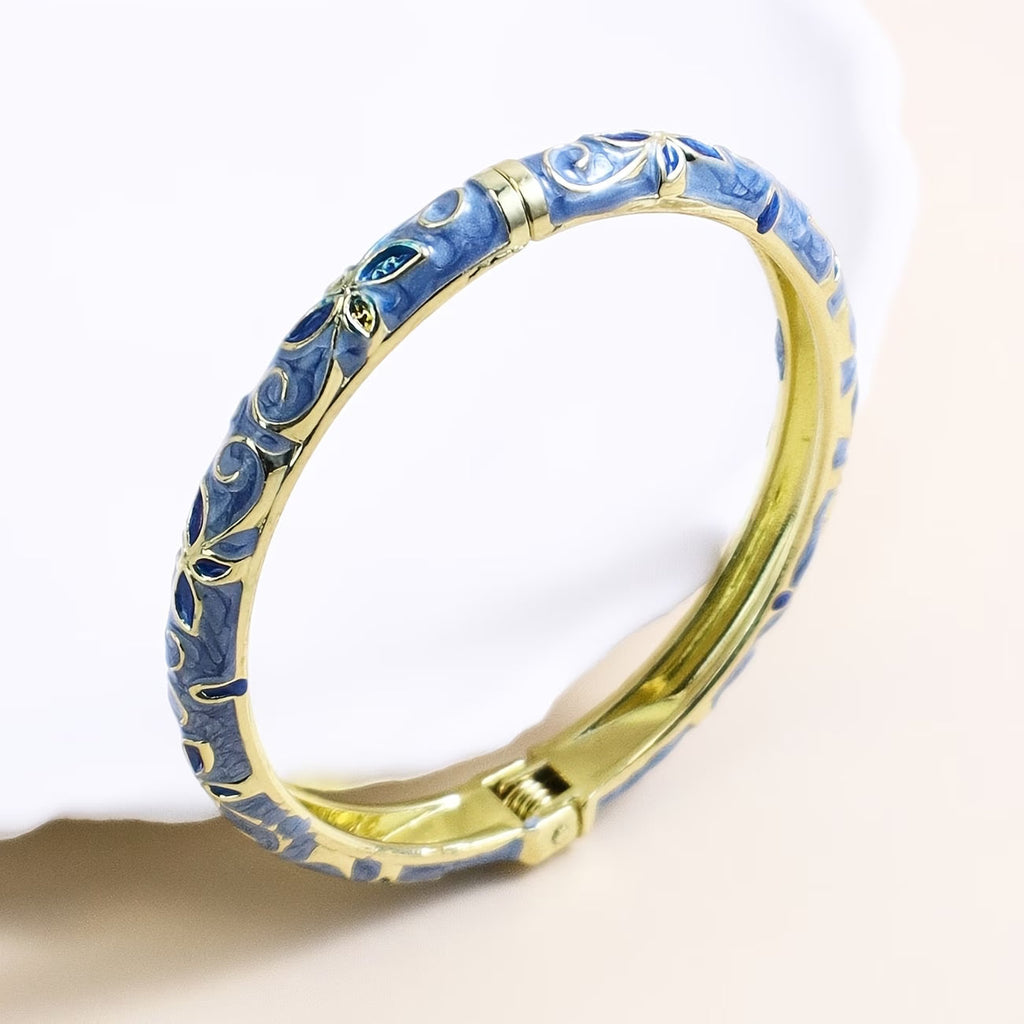 Trove Colombo Emily 18K gold plated bangle featuring blue floral enamel detailing in a vintage boho style