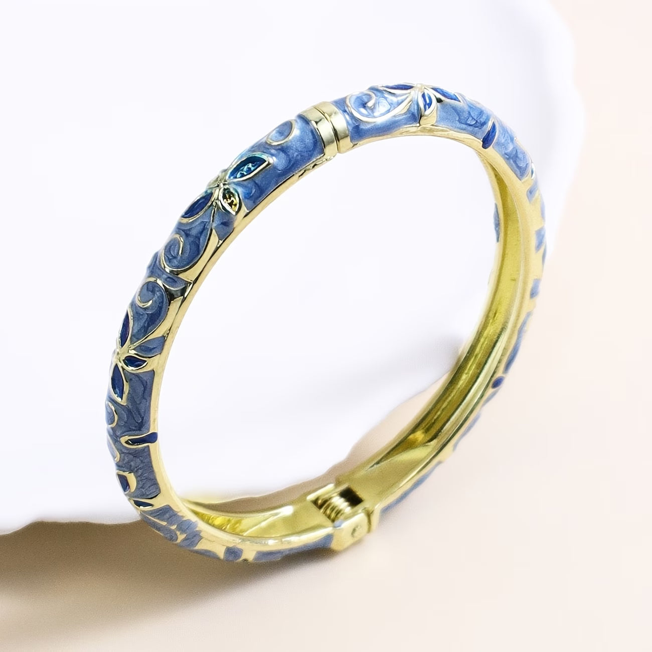 Trove Colombo Emily 18K gold plated bangle featuring blue floral enamel detailing in a vintage boho style