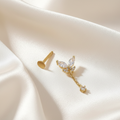 Trove Colombo Genelia 18K gold plated Genelia stud earring featuring a butterfly design with crystal accents on satin fabric.