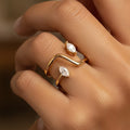 Trove Colombo Halley 18K gold-plated copper ring with a modern open design and two marquise-cut clear stones.