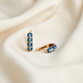 Trove Colombo Lucia KC gold-plated hoop earrings featuring a vintage royal blue and turquoise floral enamel design.