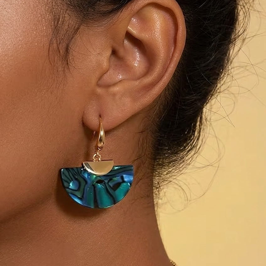 Trove Colombo Romilly boho chunky earrings featuring a blue iridescent semi-circle design on a copper ear needle