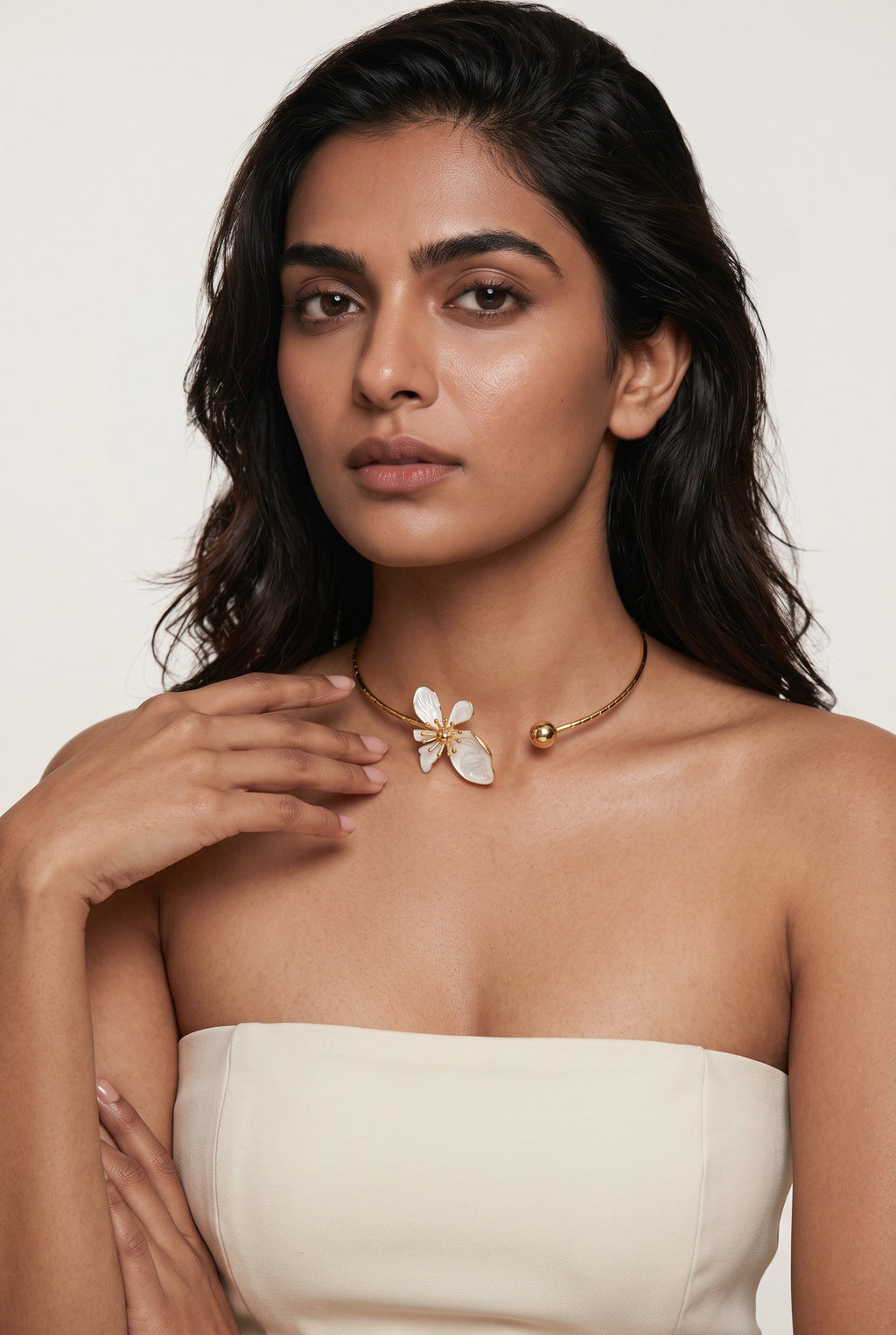 Trove Colombo Wisteria gold-tone iron choker necklace featuring a delicate grey floral charm