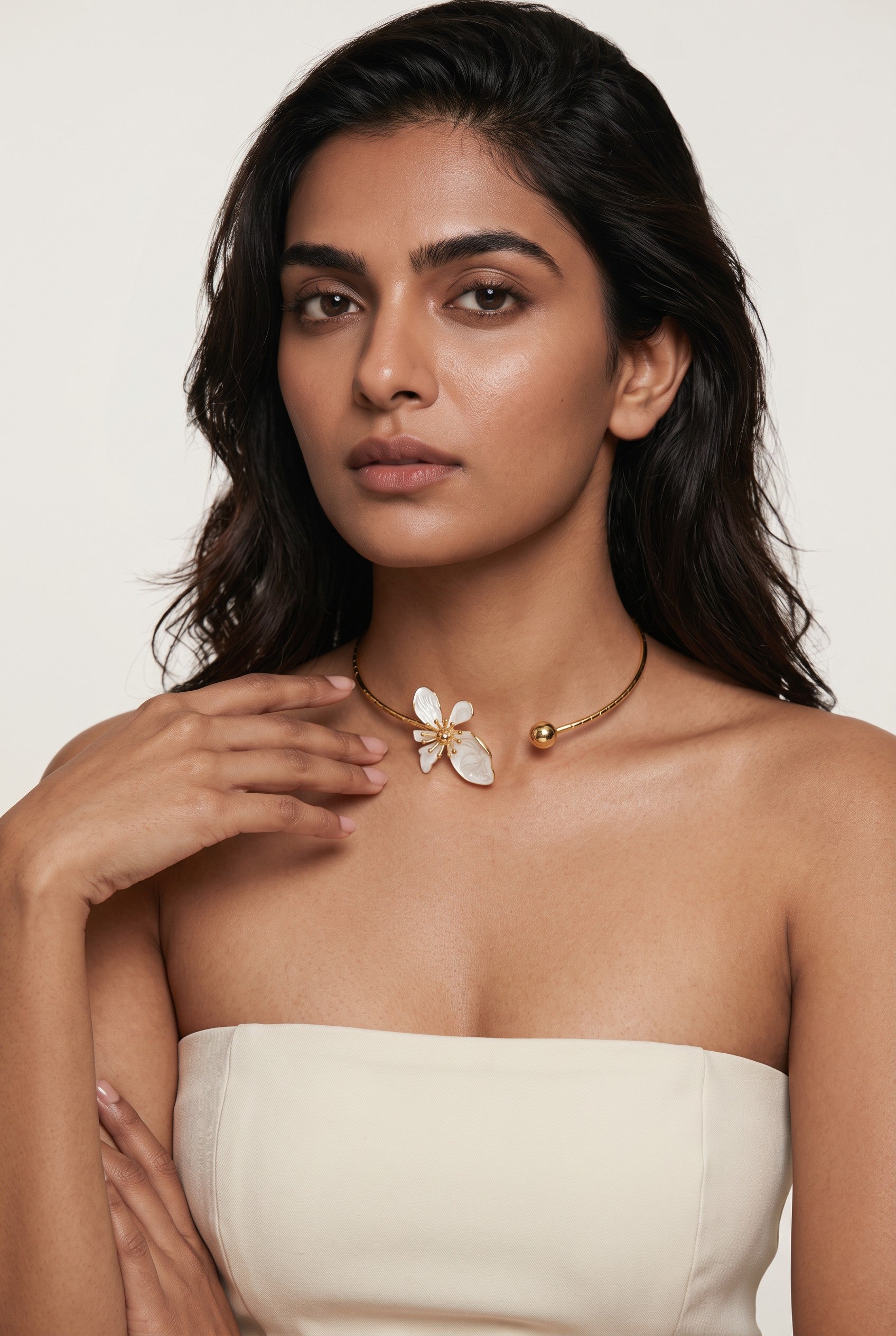 Trove Colombo Wisteria gold-tone iron choker necklace featuring a delicate grey floral charm